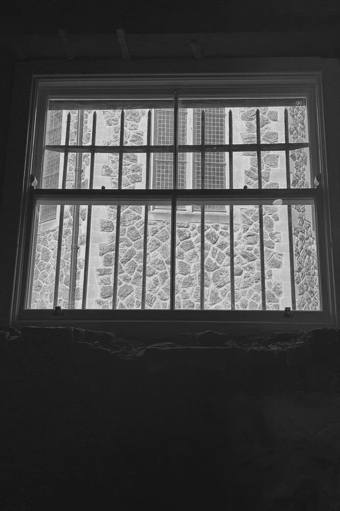 Daylight through the old barred window
